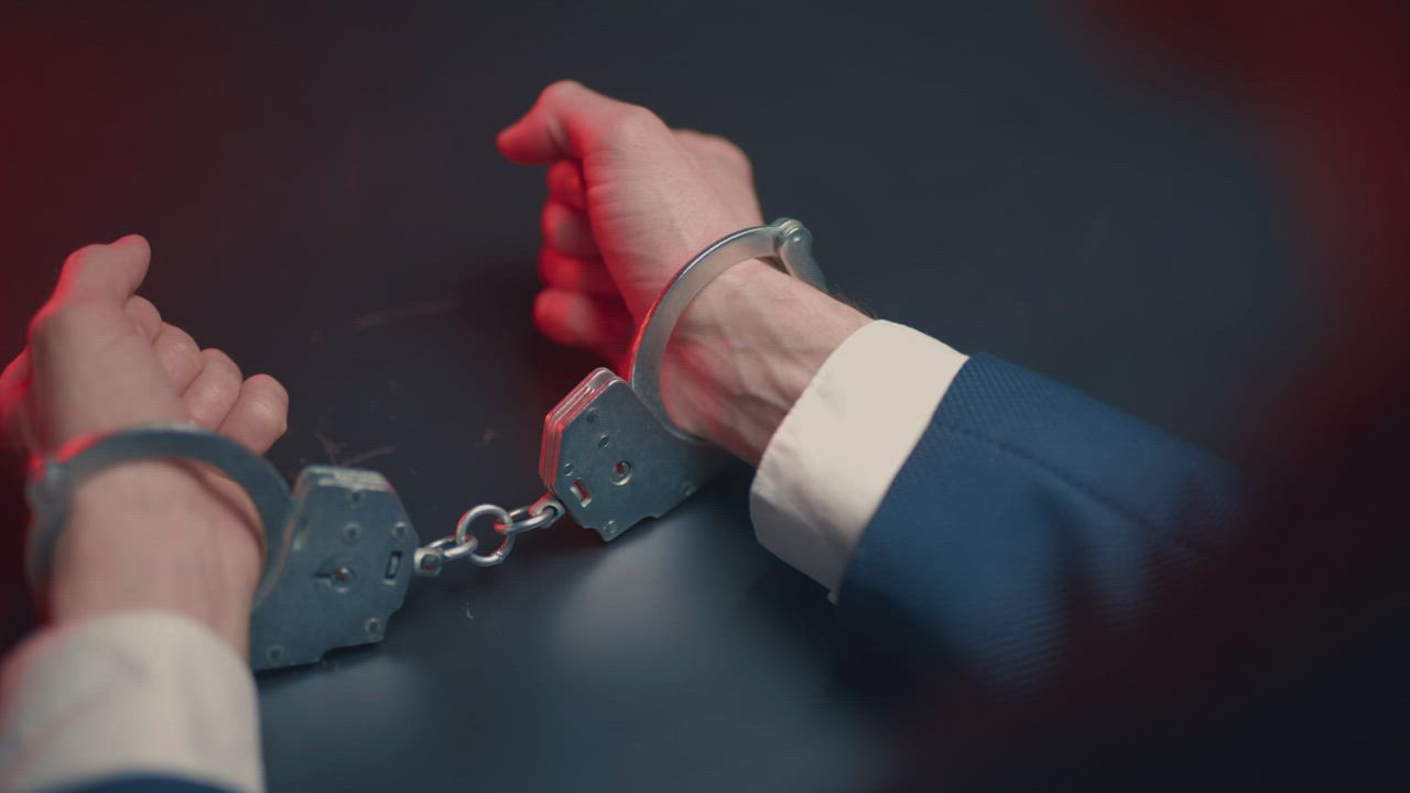 Hands in handcuffs
