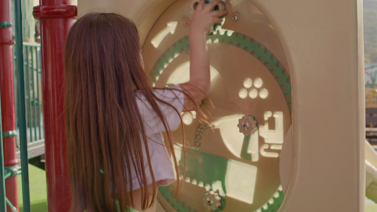 Little girl playing in a puzzle type children's game - Free Stock Video
