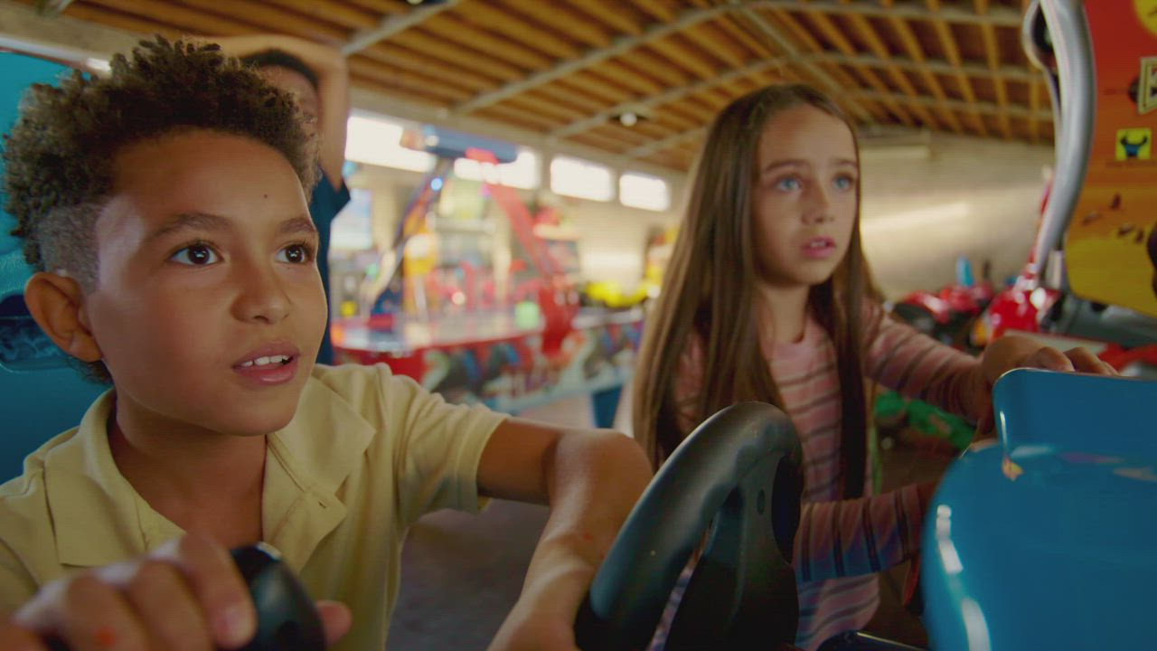 Kids having fun at the arcade shop - Free Stock Video