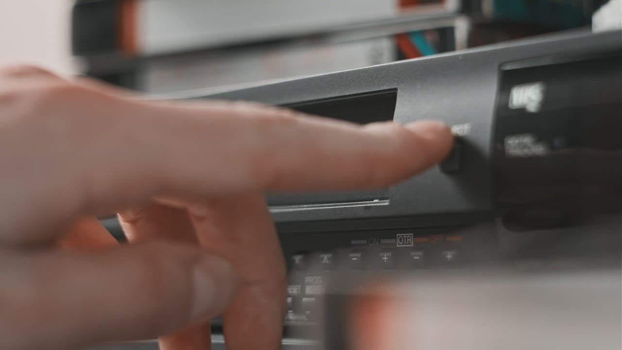 Ejecting VHS tape from the Video player Free Stock Video