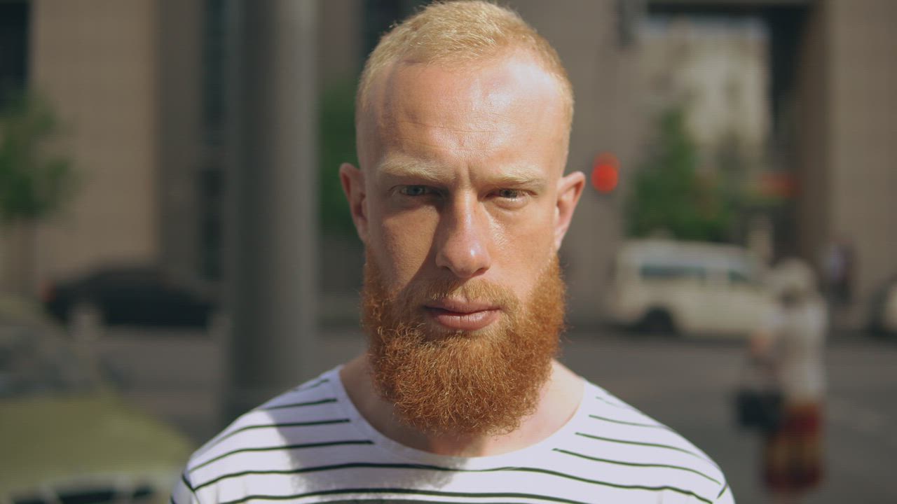 Red-bearded man smiling outdoors - Free Stock Video