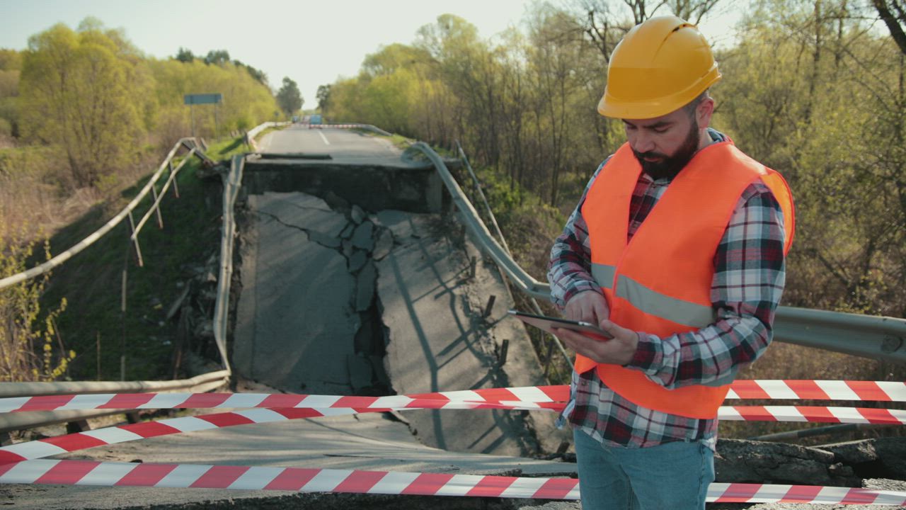 Engineer checks highway closed due to earthquake landslide - Free Stock ...