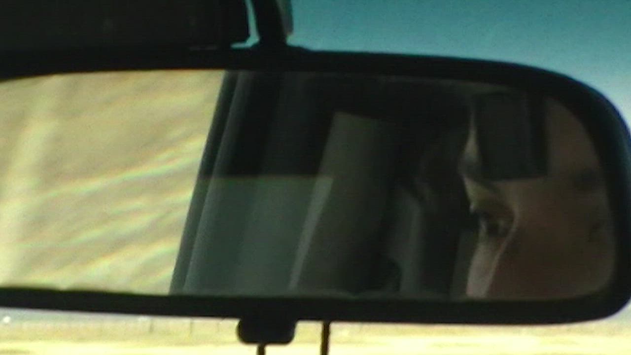 Face in the rearview mirror of a man traveling through a desert - Free ...