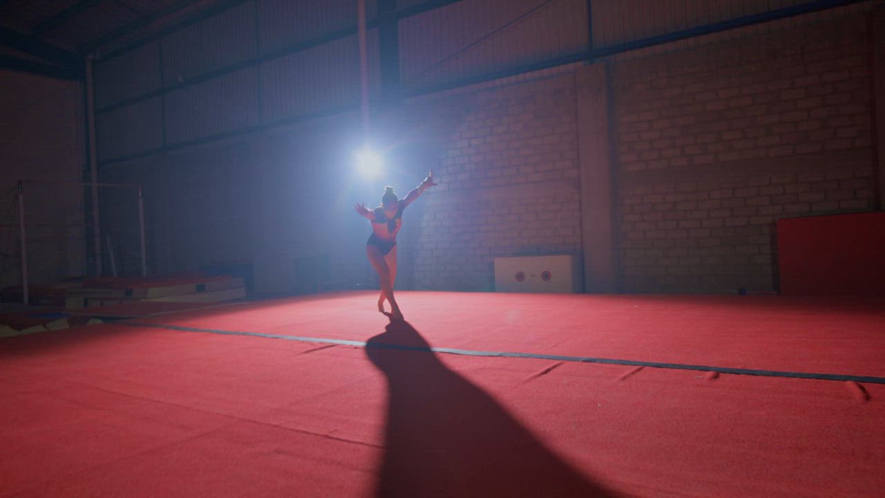 Complex somersaults of an agile gymnast - Free Stock Video