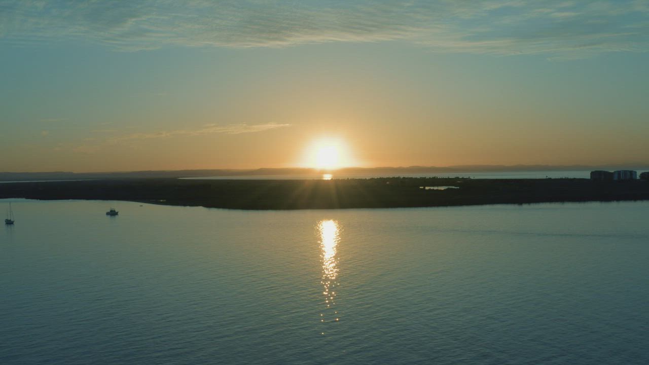 Aerial view over the sea of a sunset - Free Stock Video
