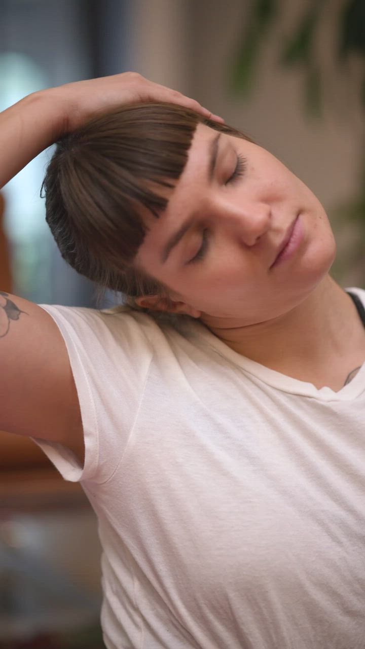 Girl stretching her neck before practicing yoga - Free Stock Video