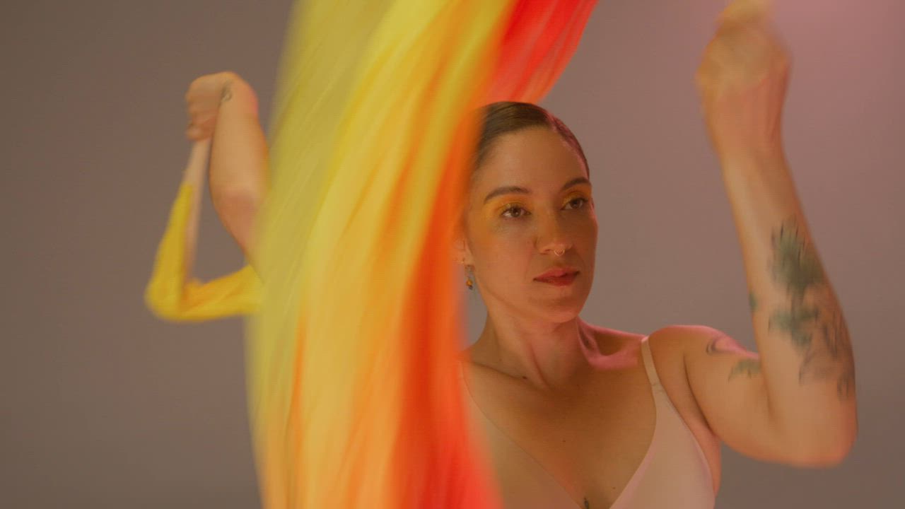 A young woman performing with colored ribbon fans - Free Stock Video