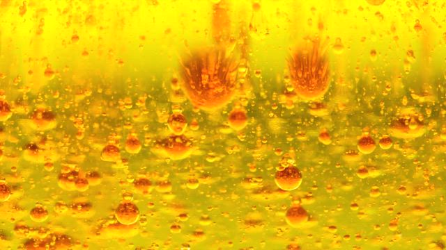 Striking shot of the liquid from a lava lamp.