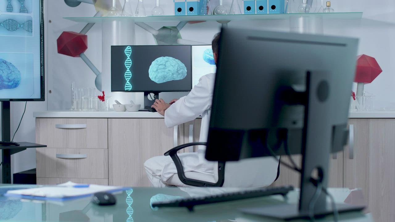 Doctor working on DNA and brain models in lab - Free Stock Video
