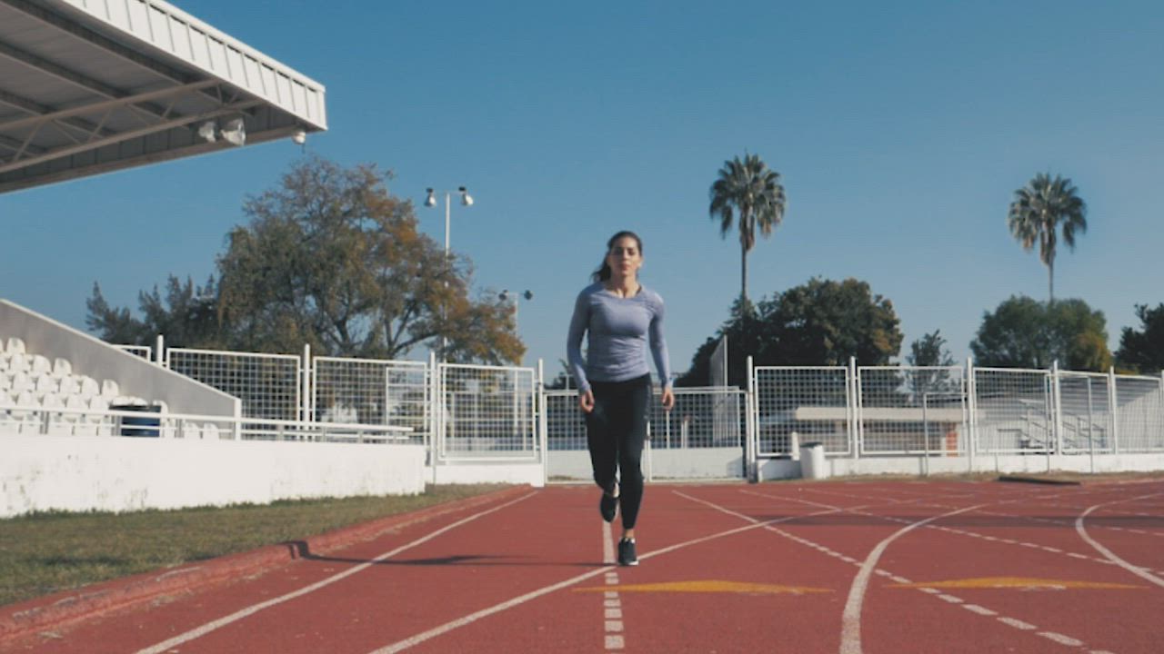 Front view of a woman running - Free Stock Video