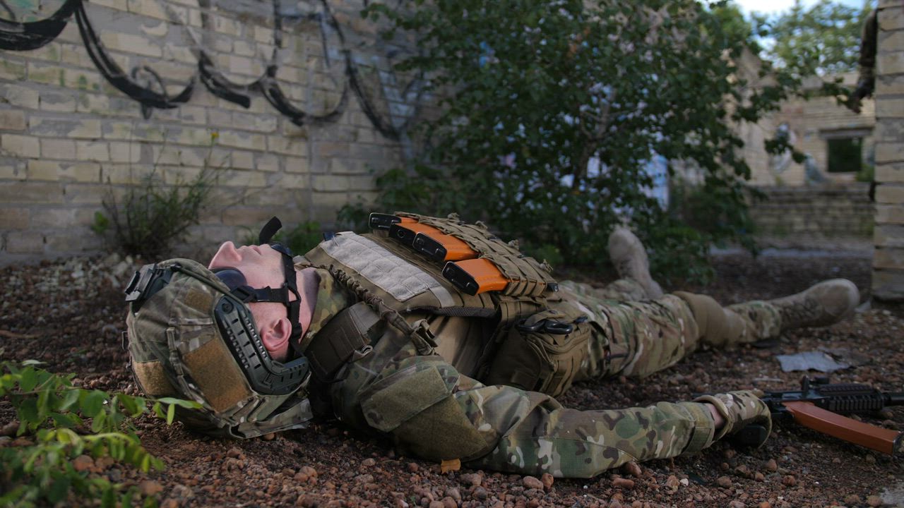 Wounded soldier being assisted - Free Stock Video