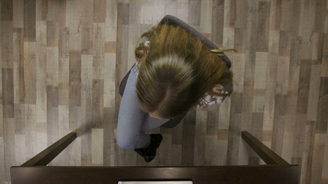 Woman spinning on her chair.