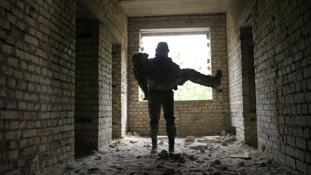 Unconscious soldier carried out.