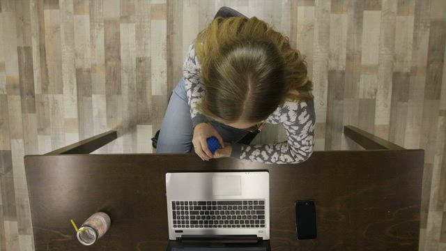 Stressed woman working slowly.