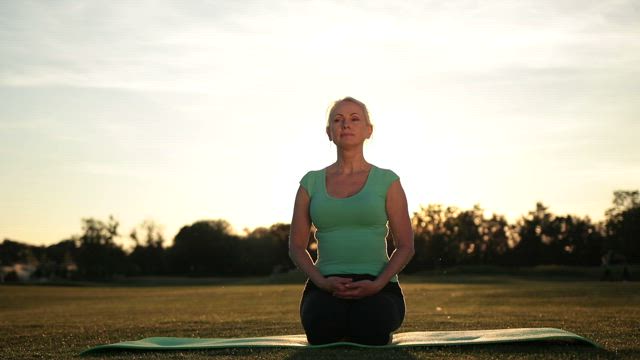 Older woman doing Yoga.