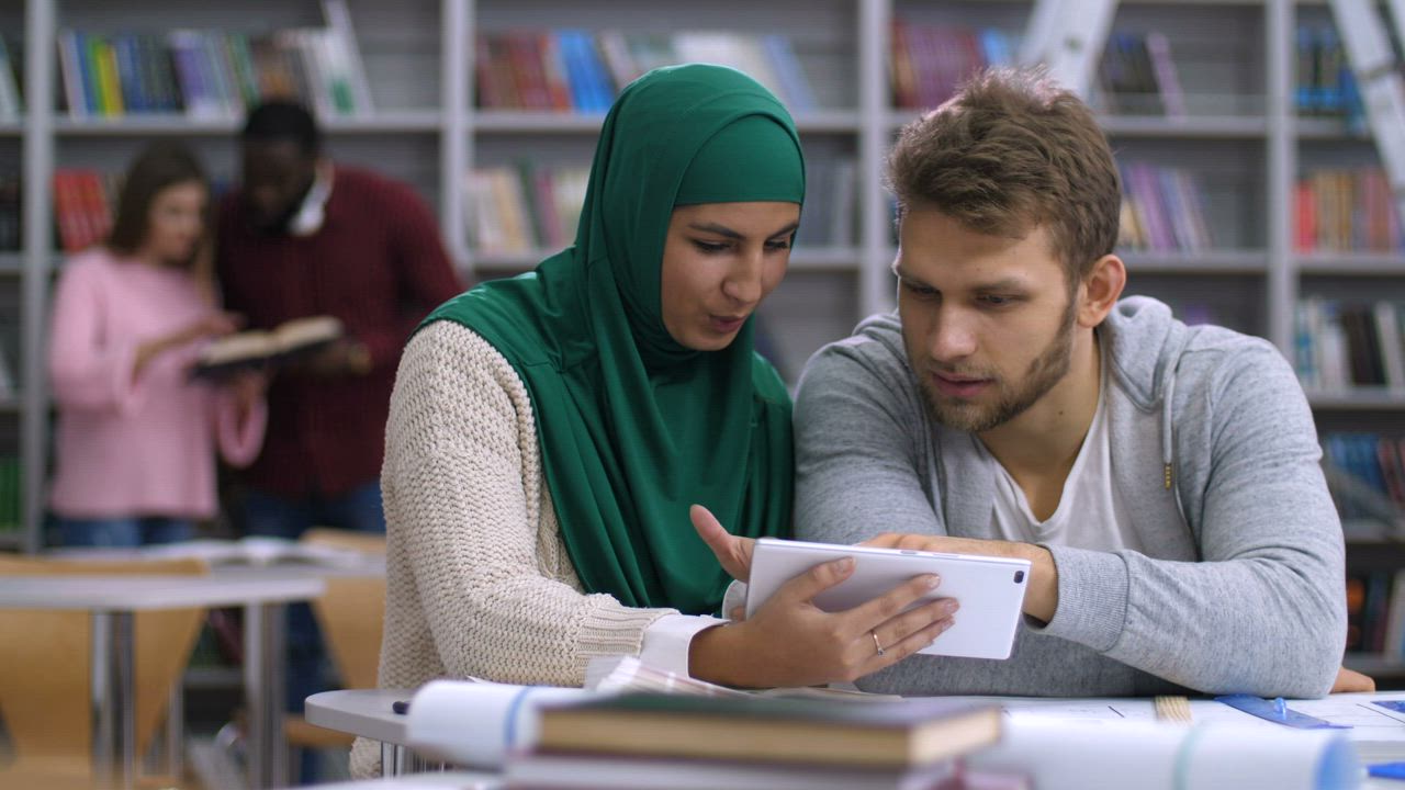 Couple learning with a tablet - Free Stock Video