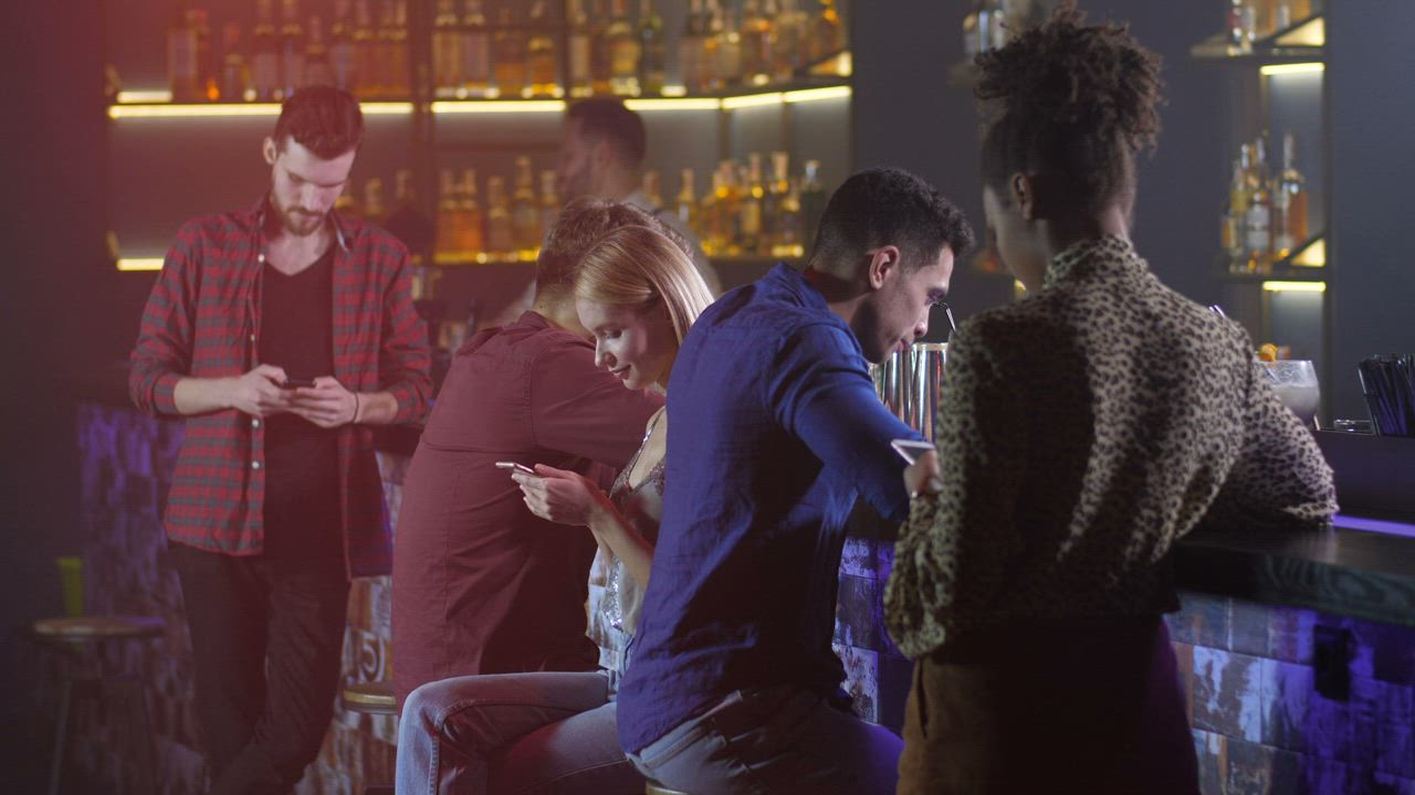 Friends using their phones while out - Free Stock Video
