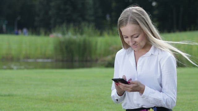 Young woman working from her phone.