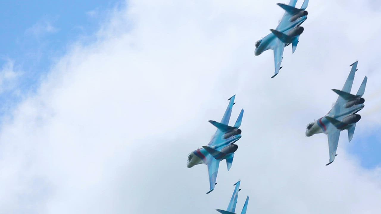 Combat airplanes do acrobatics in the sky - Free Stock Video