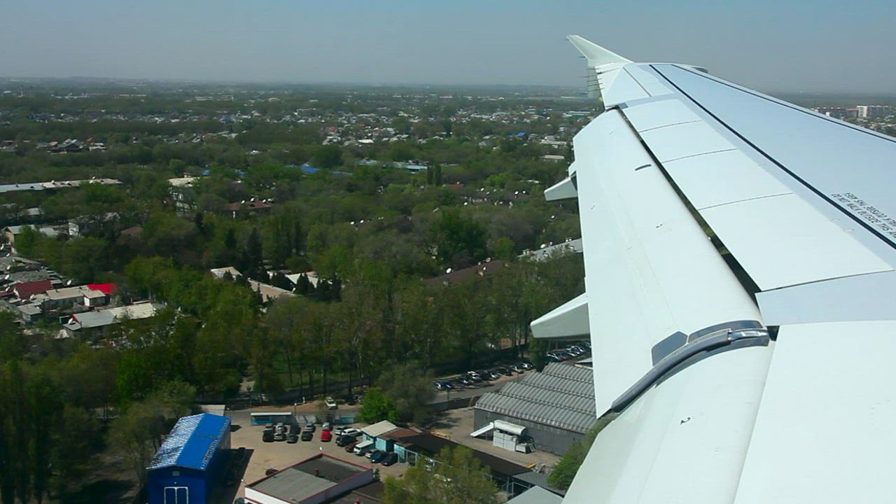 Window view of an airplane landing in the airport - Free Stock Video