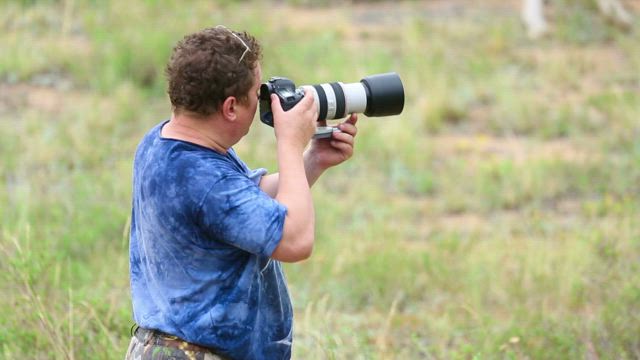 Photographer working in the field.
