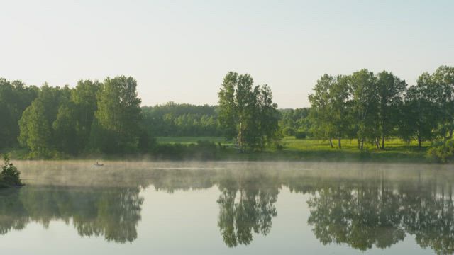 Lake in the morrning with mist .
