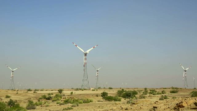 Windmills moving in the countryside.