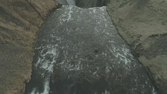 Mountain river leading to a waterfall, landscape.