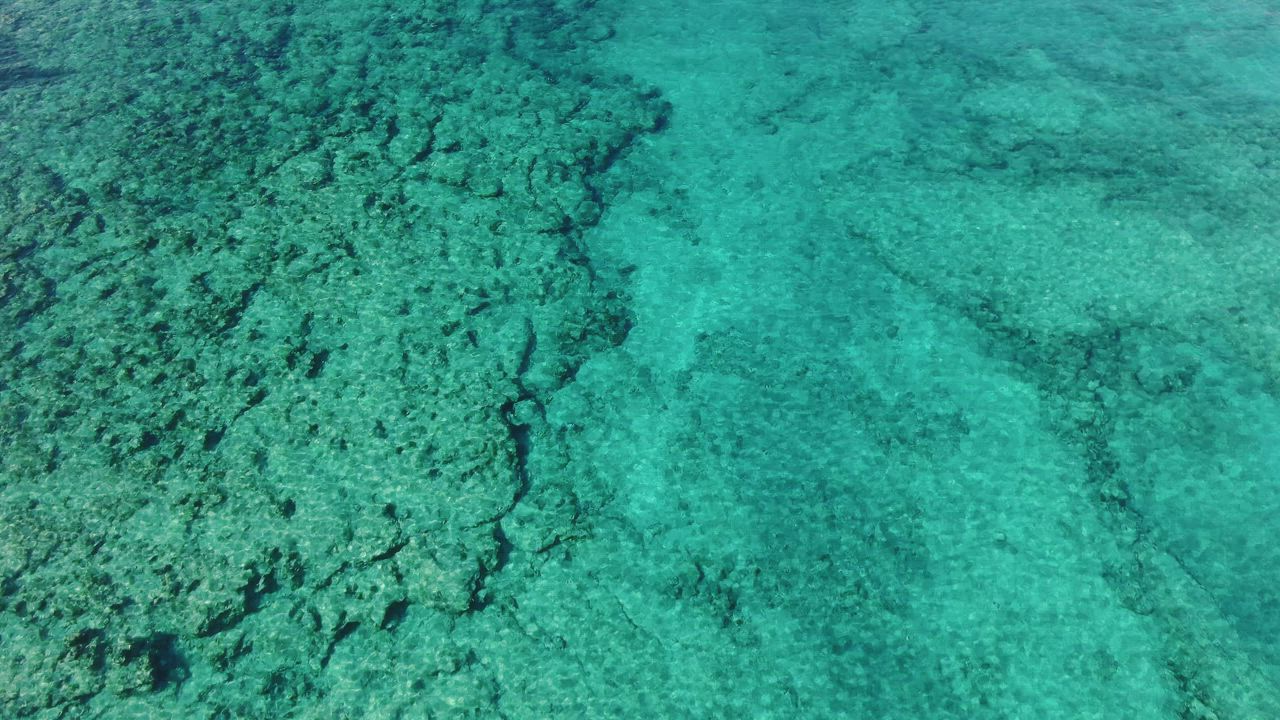Looking across the sea in turquoise waters - Free Stock Video