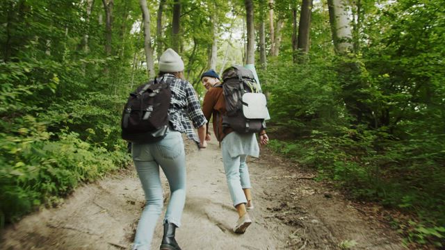 Couple enjoy the freedom of outdoors on hike.