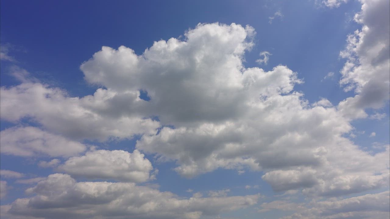 Time-lapse of the clouds traveling in the sky - Free Stock Video