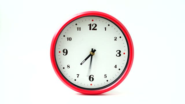 Wall clock with red frame.