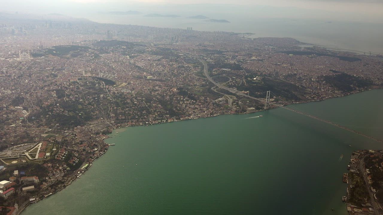 Aerial view of a city and a connecting bridge - Free Stock Video