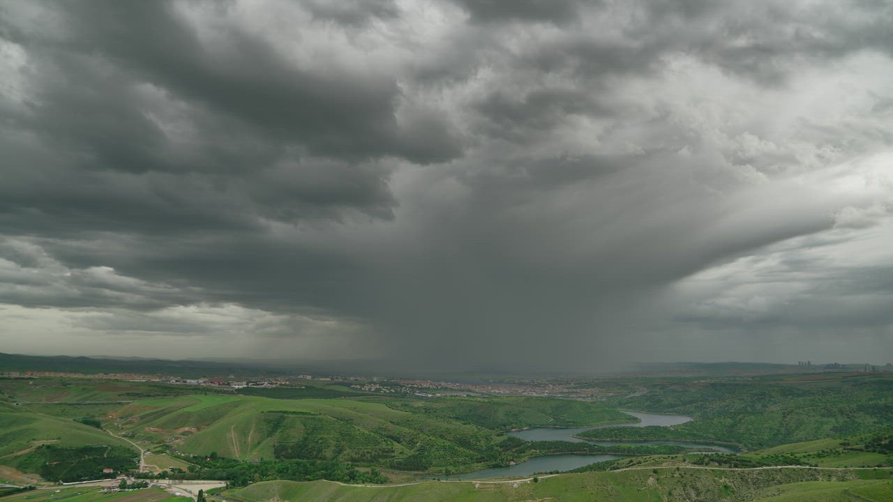 Storm clouds over the green valley - Free Stock Video