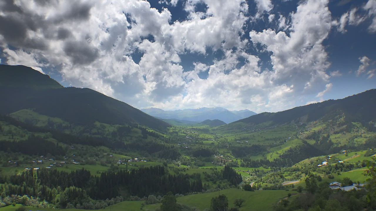Valley in the mountains with a cloudy sky - Free Stock Video