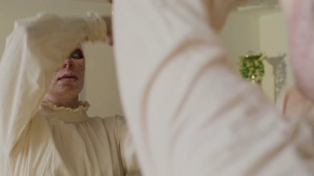 Woman Adding Wig to Monster Cosplay.