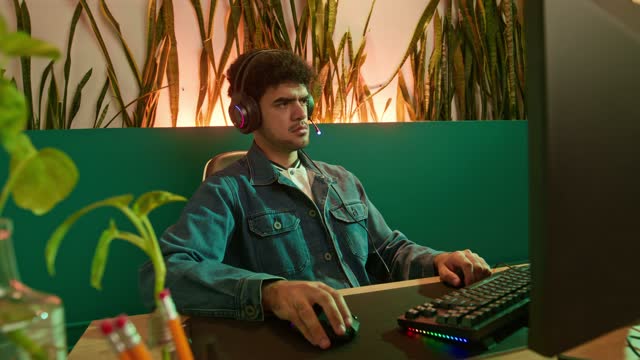 Young Man Working with Gaming Gadgets.